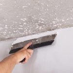 Professional removing popcorn ceiling